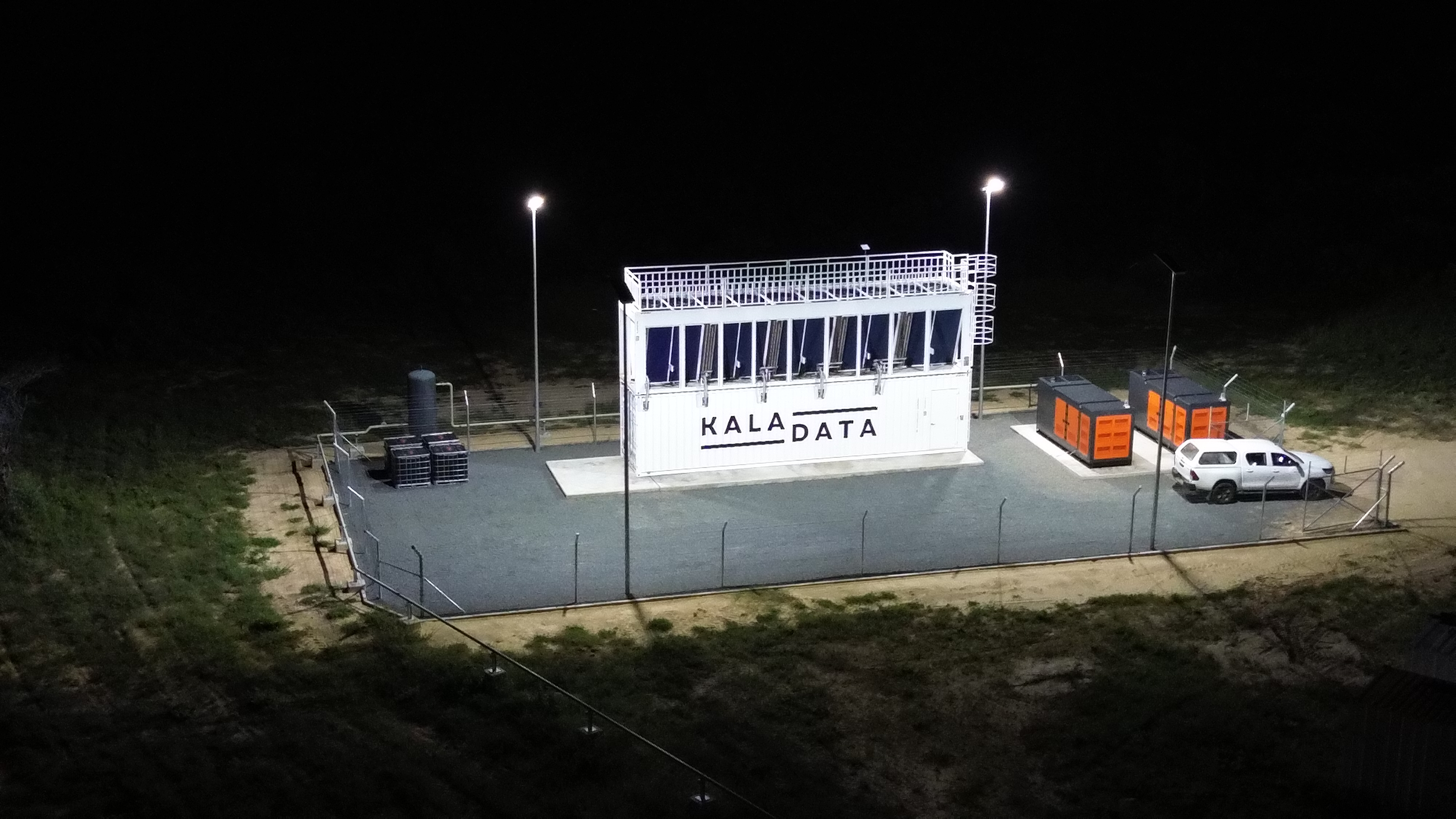 Kala Data modular data centre unit lit up at night at the Botswana site